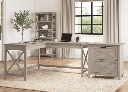 L shaped desk and file cabinet space view washed gray